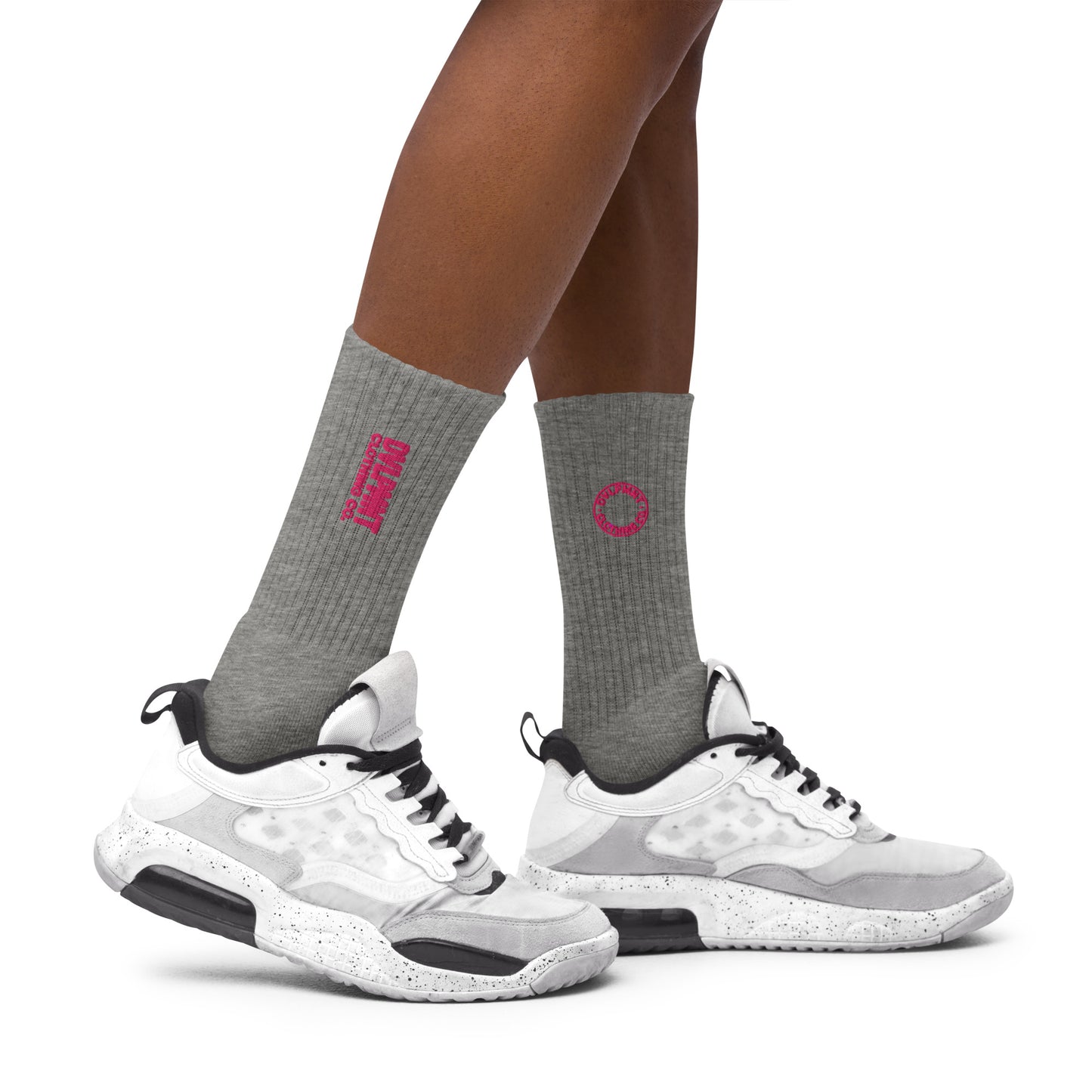 Black embroidered socks by DVLPMNT CLOTHING CO., featuring detailed embroidery design and comfortable fit.