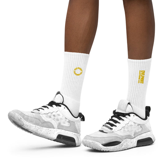 Black embroidered socks by DVLPMNT CLOTHING CO., featuring detailed embroidery and a comfortable fit in size small.