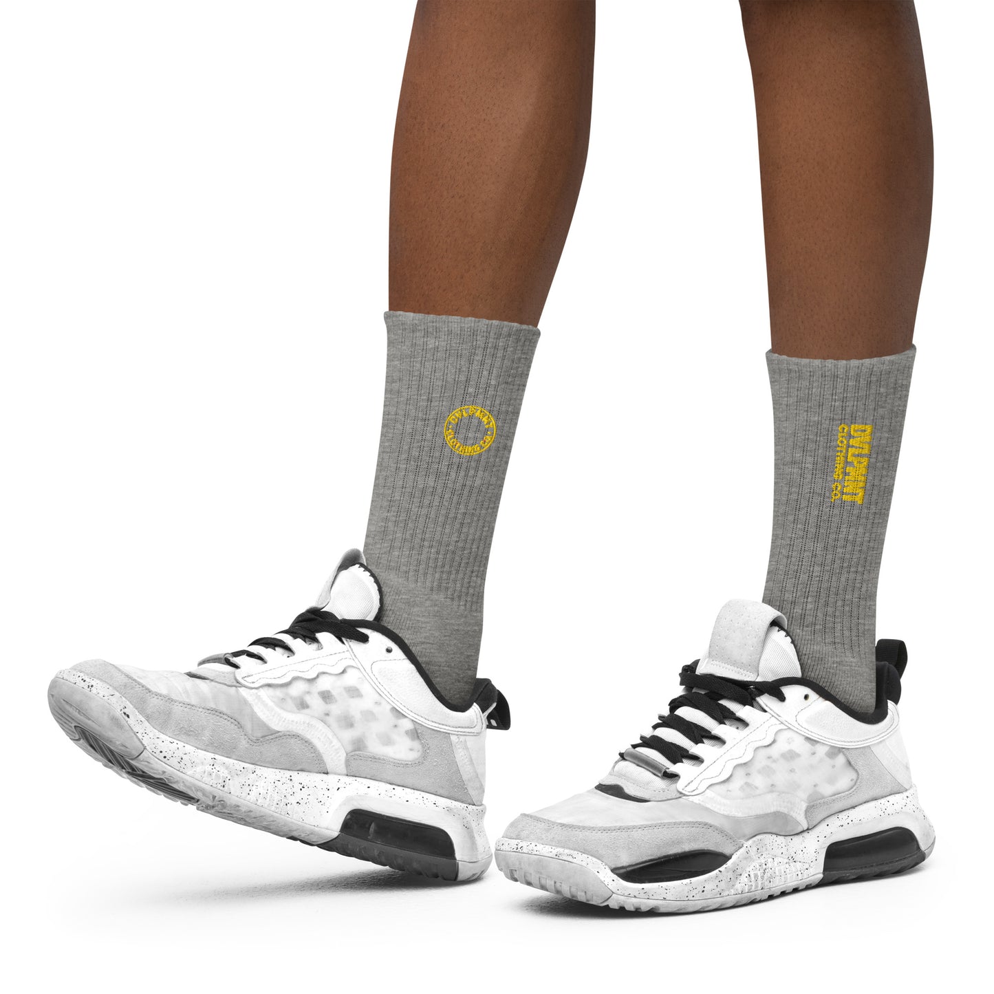 Black embroidered socks by DVLPMNT CLOTHING CO., featuring detailed embroidery and a comfortable fit in size small.