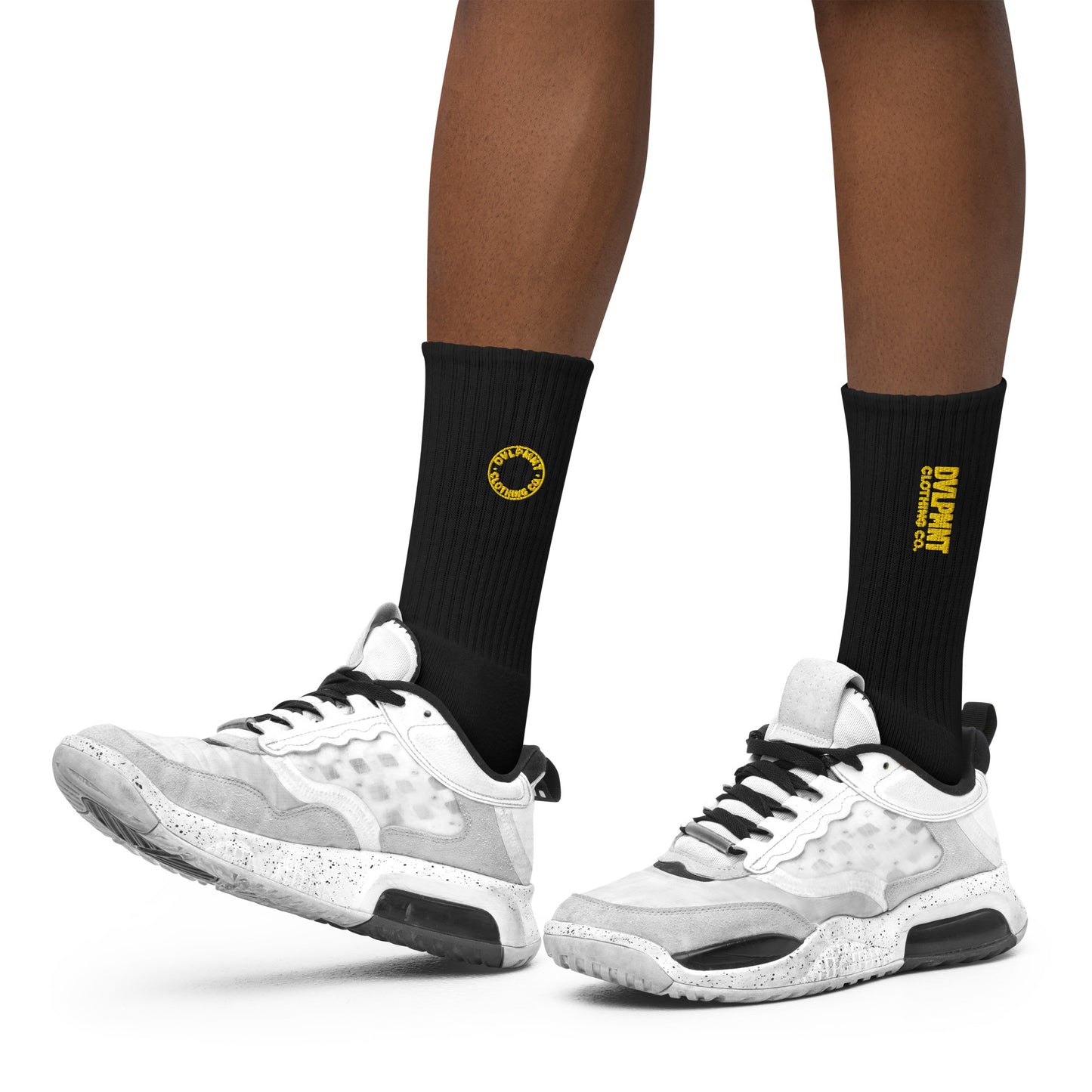 Black embroidered socks from DVLPMNT CLOTHING CO. with detailed embroidery, size small, showcasing stylish craftsmanship.