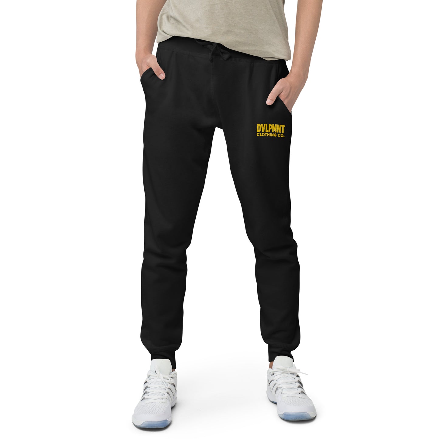 Black unisex fleece sweatpants by DVLPMNT CLOTHING CO., comfortable casual loungewear with elastic waistband and relaxed fit.