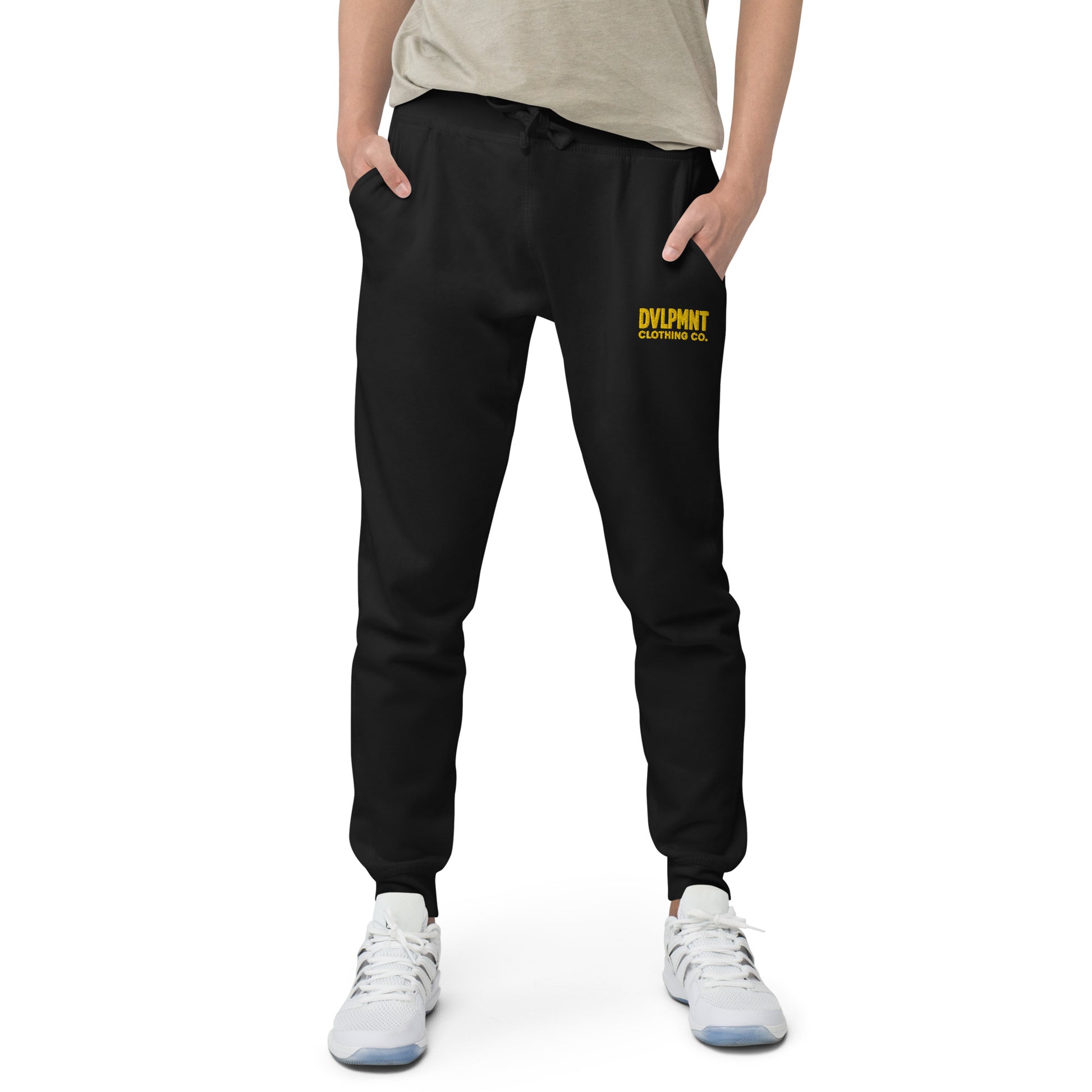 Black unisex fleece sweatpants by DVLPMNT CLOTHING CO., comfortable casual loungewear with elastic waistband and relaxed fit.