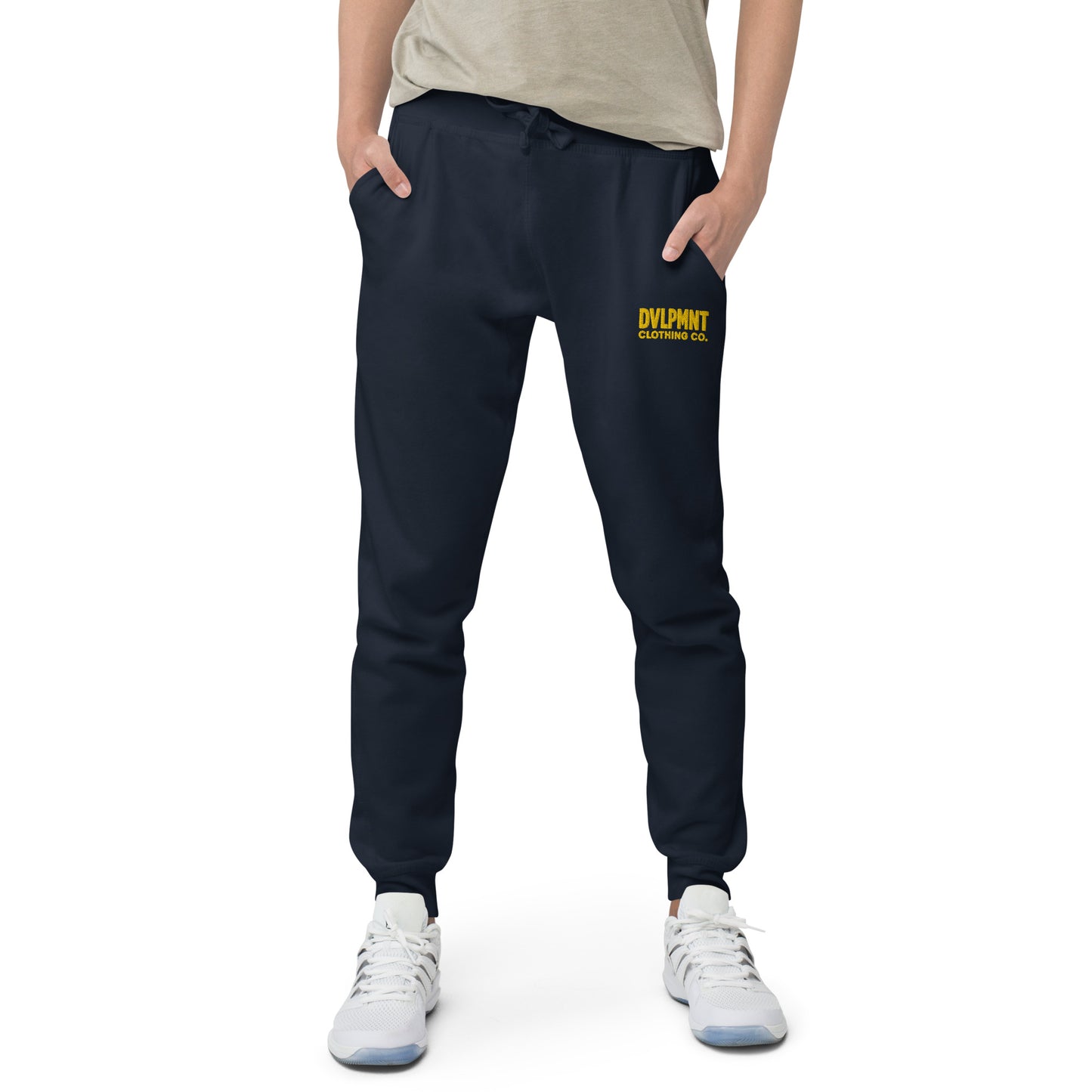 Unisex black fleece sweatpants by DVLPMNT CLOTHING CO. shown in a product image, featuring a relaxed fit and comfortable fabric.