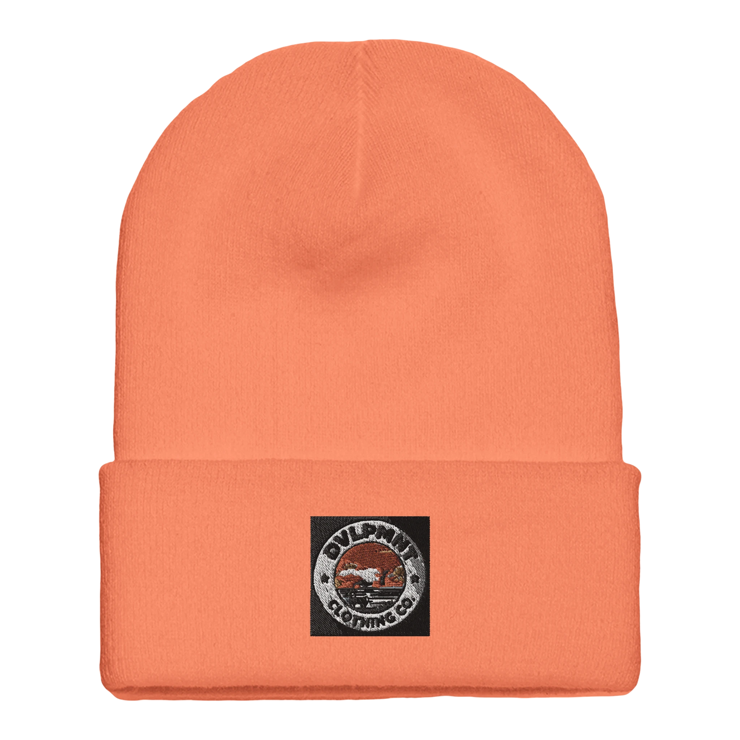 DVLPMNT CLOTHING CO. cuffed beanie made of print material in gold, featuring a cozy, stylish design with visible branding.