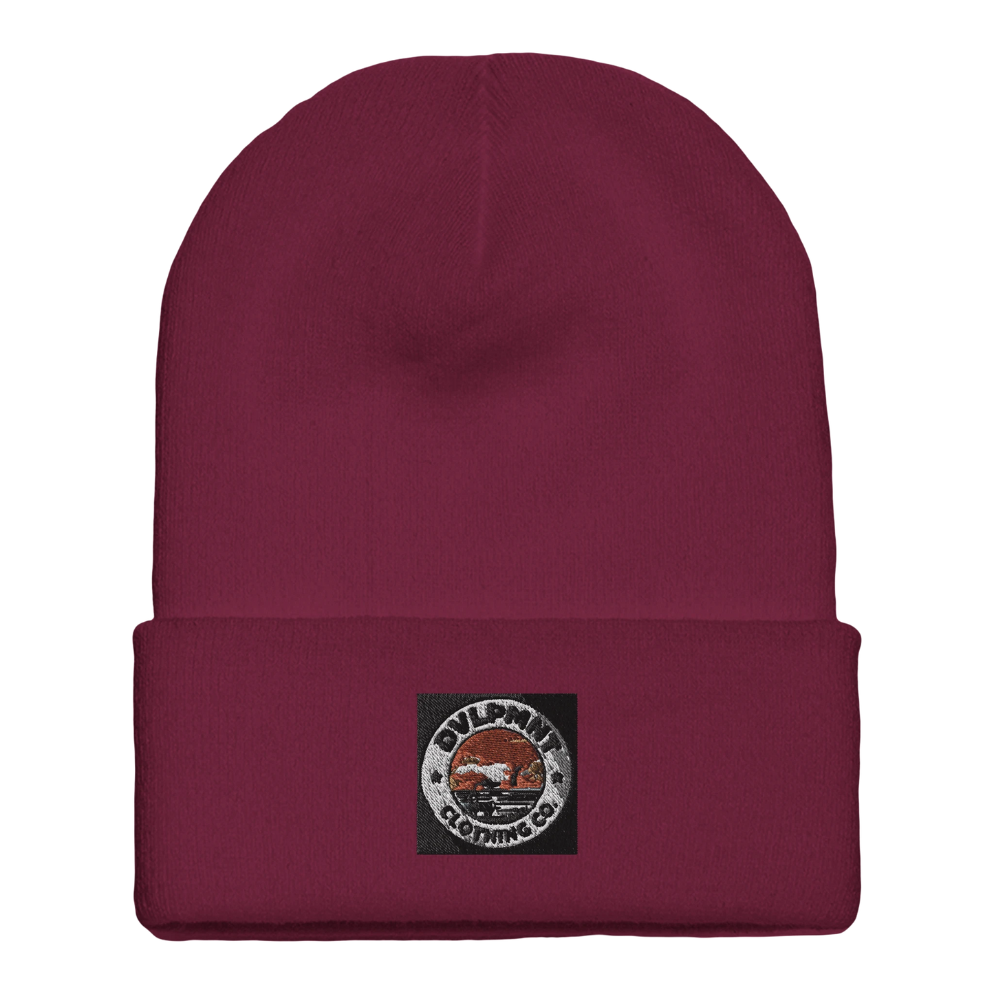Gold print beanie by DVLPMNT LIFESTYLE CO. featuring a cuffed style and soft print material on a neutral background.